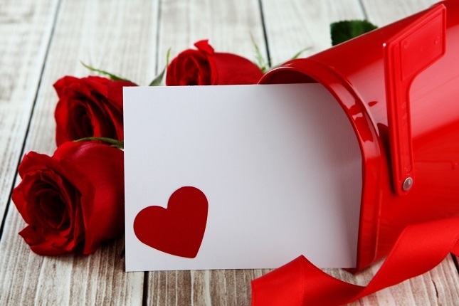 Valentine's Day: Red mailbox, letter with a heart inside, and red roses