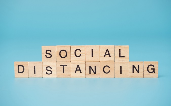 Cubes that say, "Social Distancing"